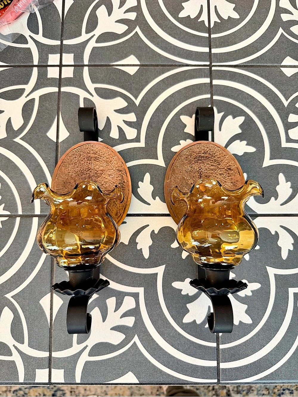 Pair of vintage amber glass and black metal wall sconce candle holders